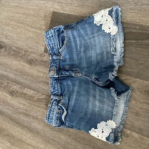 regular blue jean shorts eight some flower stitches in it a L 10/12